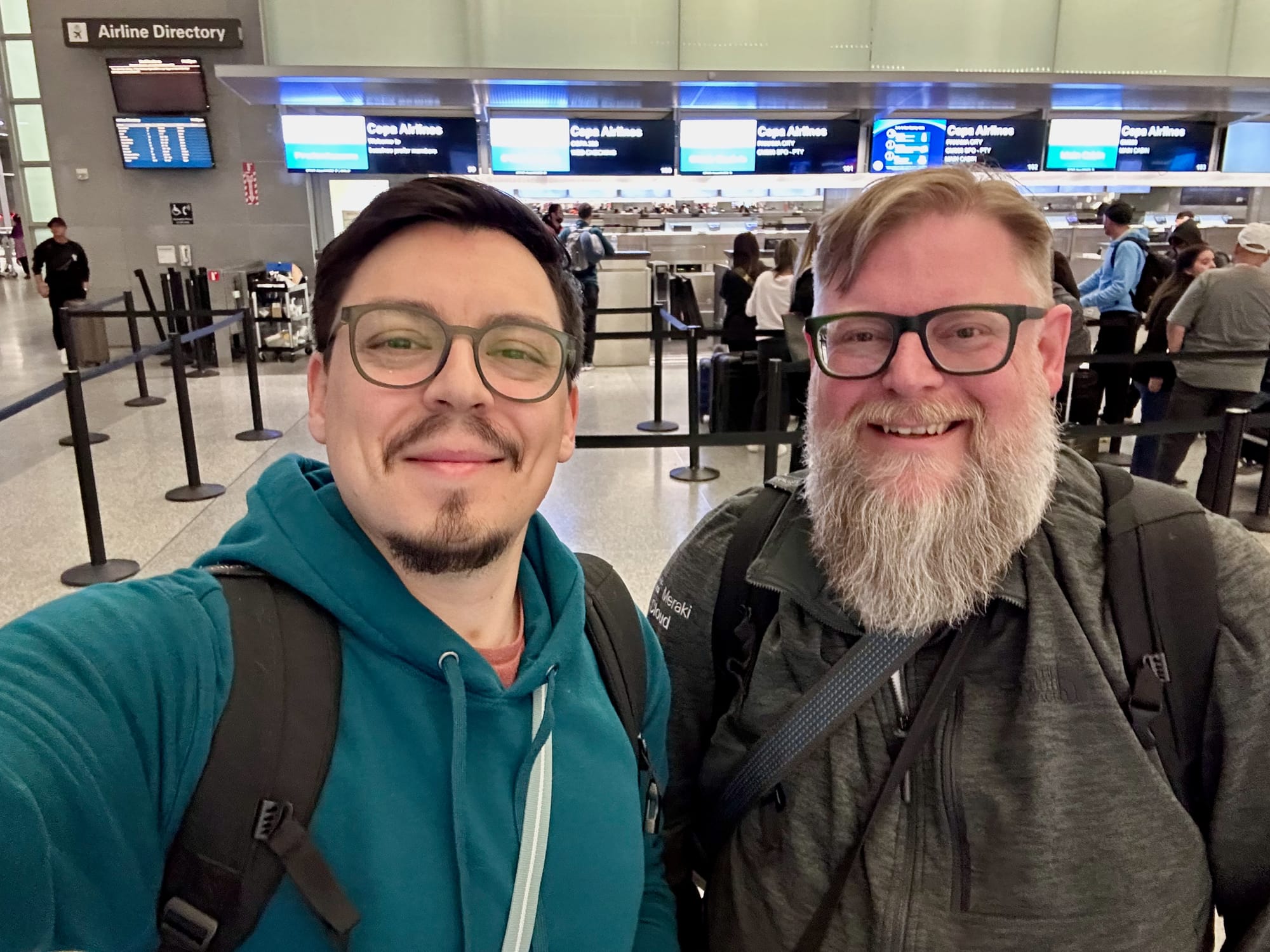 Fito von Zastrow and Alan Ridlehoover are smiling as they leave SFO for ASU