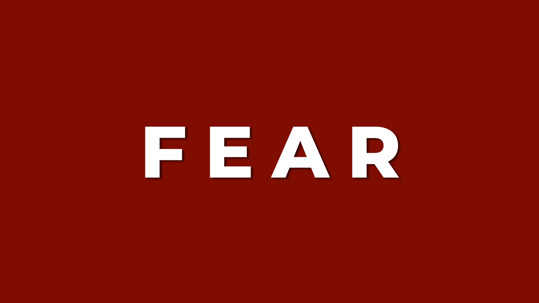 Red slide with white text that says "FEAR"