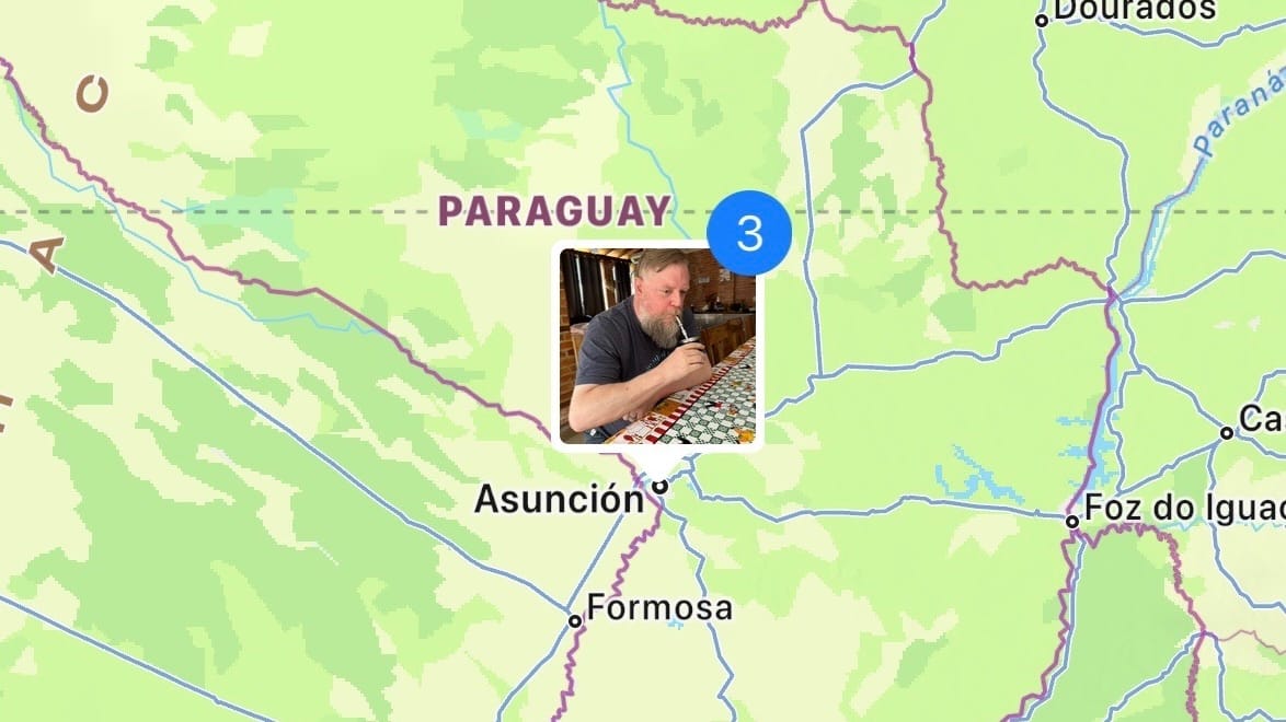 A map of the region around Asunción, Paraguay, with a picture of a bearded man drinking maté